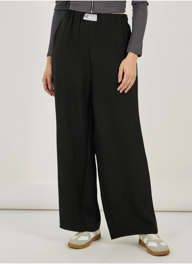 ستايلي Styli Textured Mid Rise Wide Leg Pants with Badge Detail