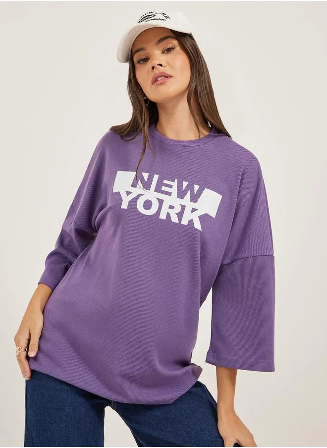 Styli Textured Slogan Print Dropped Shoulder Oversized T-Shirt