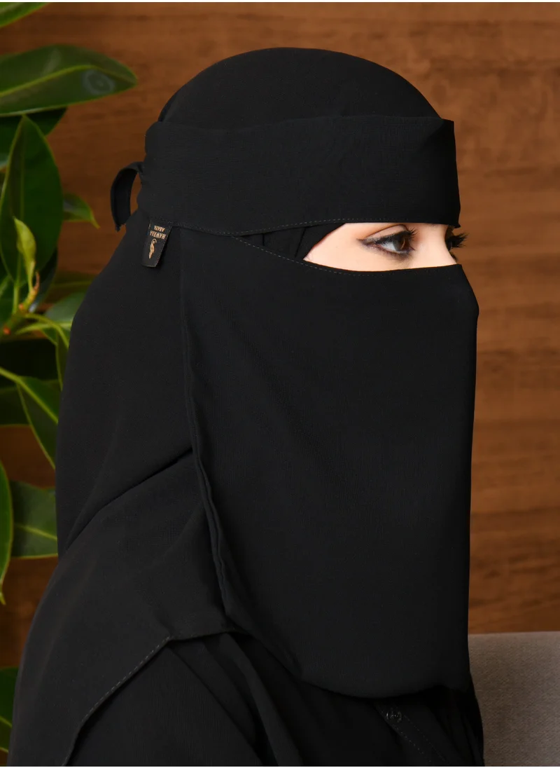 HAWRAA ABAYA A short embroidered niqab with a drawstring and a logo