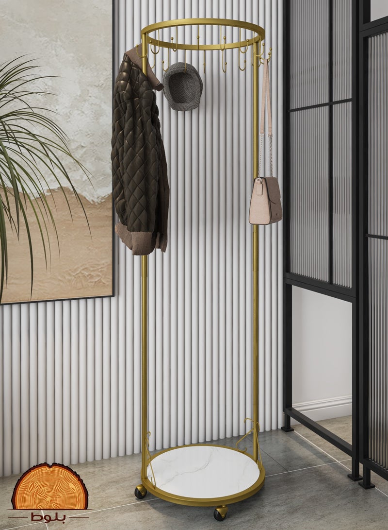 Clothes hanger rack with a luxurious design in golden color