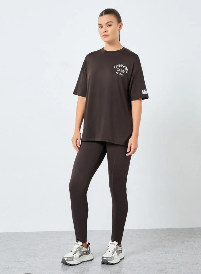 Styli Active Gymspire Edition - Label and Tab Dropped Shoulder Short Sleeve Top with Text Detail