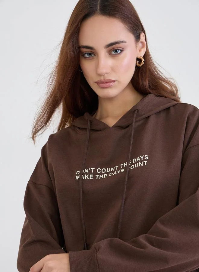 Styli Brown Oversized Slogan Print Hoodie