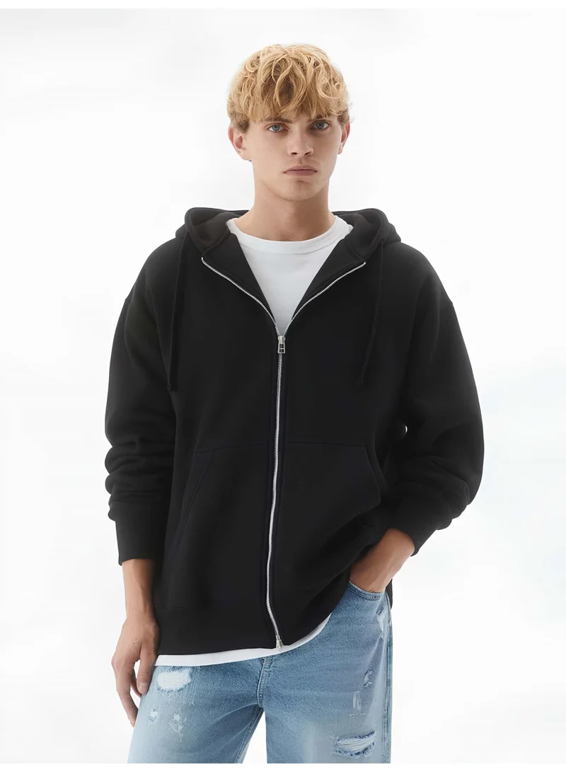 مانياك سويت شيرت رجالي أسود سادة بقلنسوة وسحاب كامل وأكمام طويلة بقصة واسعة من التيري الفرنسي