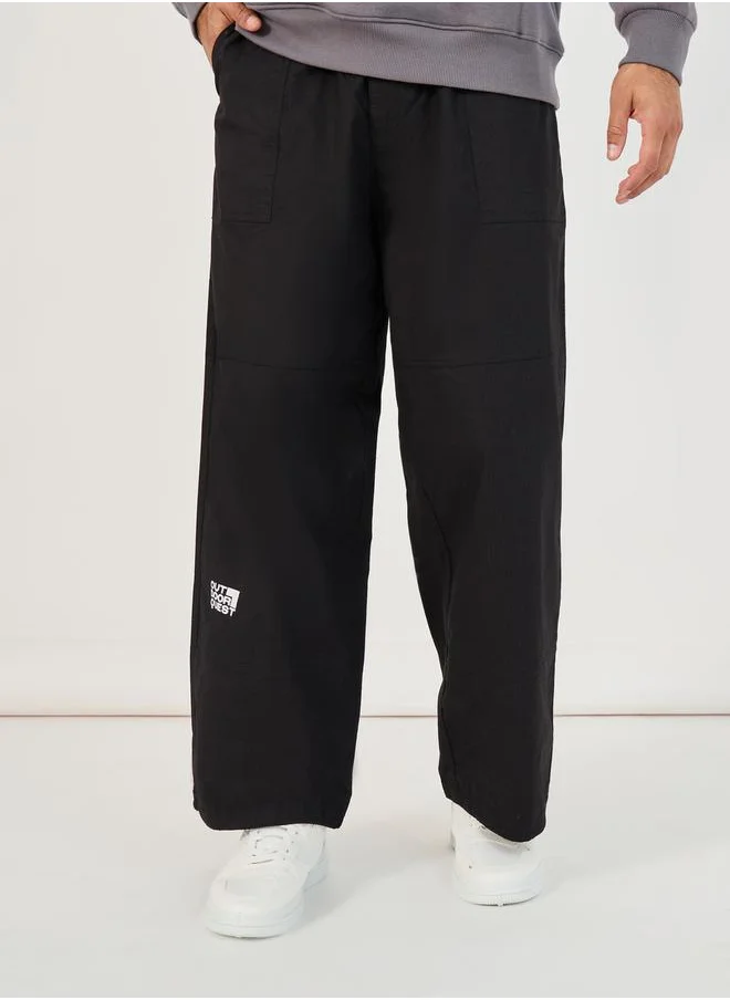 Styli Slogan Print Baggy Parachute Fit Pants with Drawstring