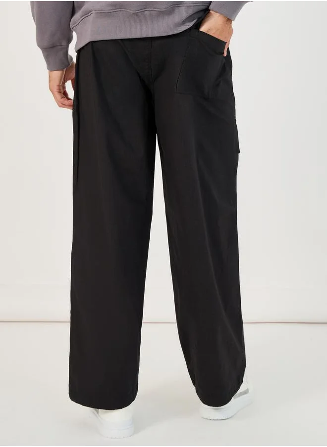 Styli Slogan Print Baggy Parachute Fit Pants with Drawstring