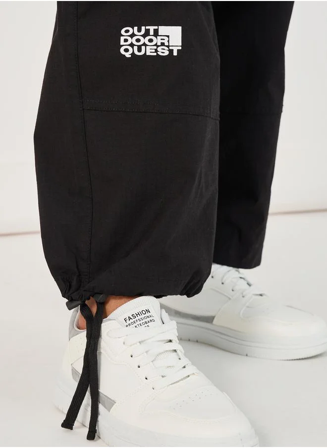 Styli Slogan Print Baggy Parachute Fit Pants with Drawstring