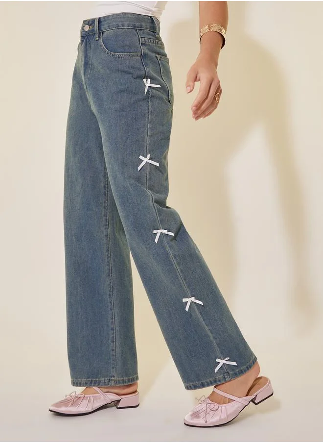 Styli Mid Rise Wide Leg Faded Jeans with Bow Detail