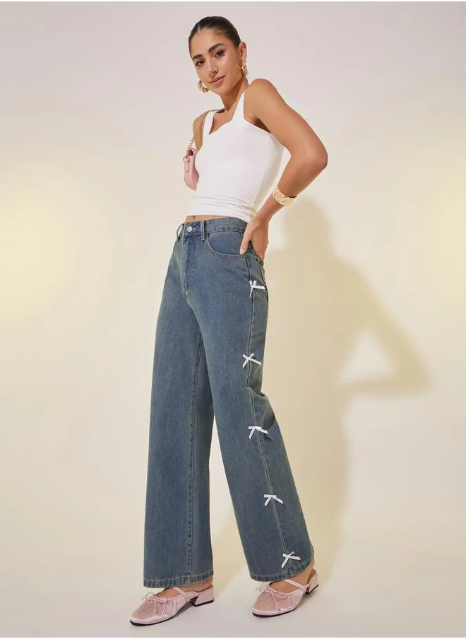 ستايلي Mid Rise Wide Leg Faded Jeans with Bow Detail