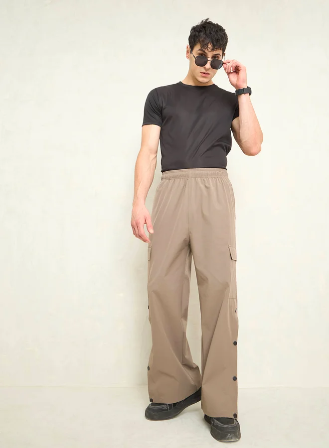 SASSAFRAS Sassafras Solid Button Detail Baggy Parachute Pants