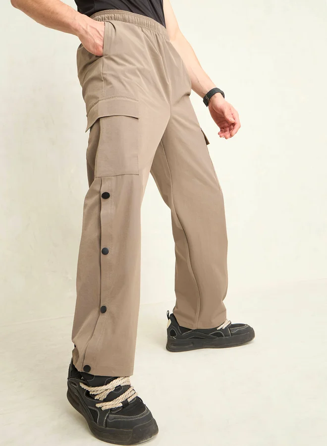 SASSAFRAS Sassafras Solid Button Detail Baggy Parachute Pants