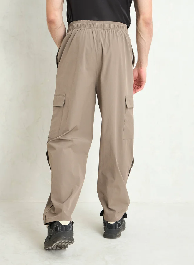 SASSAFRAS Solid Button Detail Baggy Parachute Pants