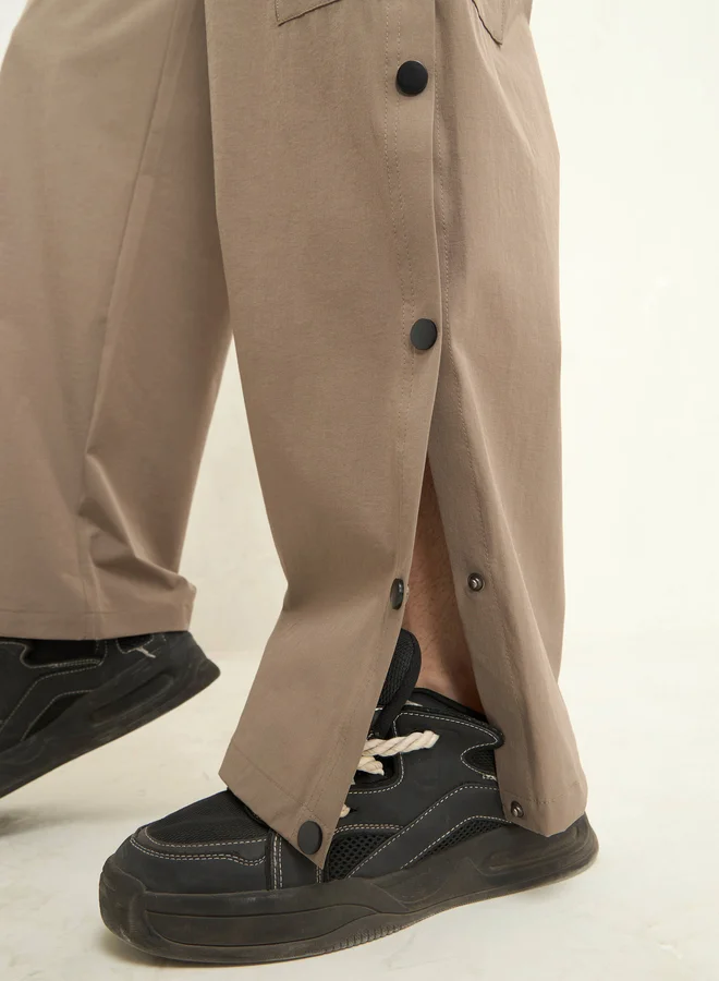 SASSAFRAS Solid Button Detail Baggy Parachute Pants