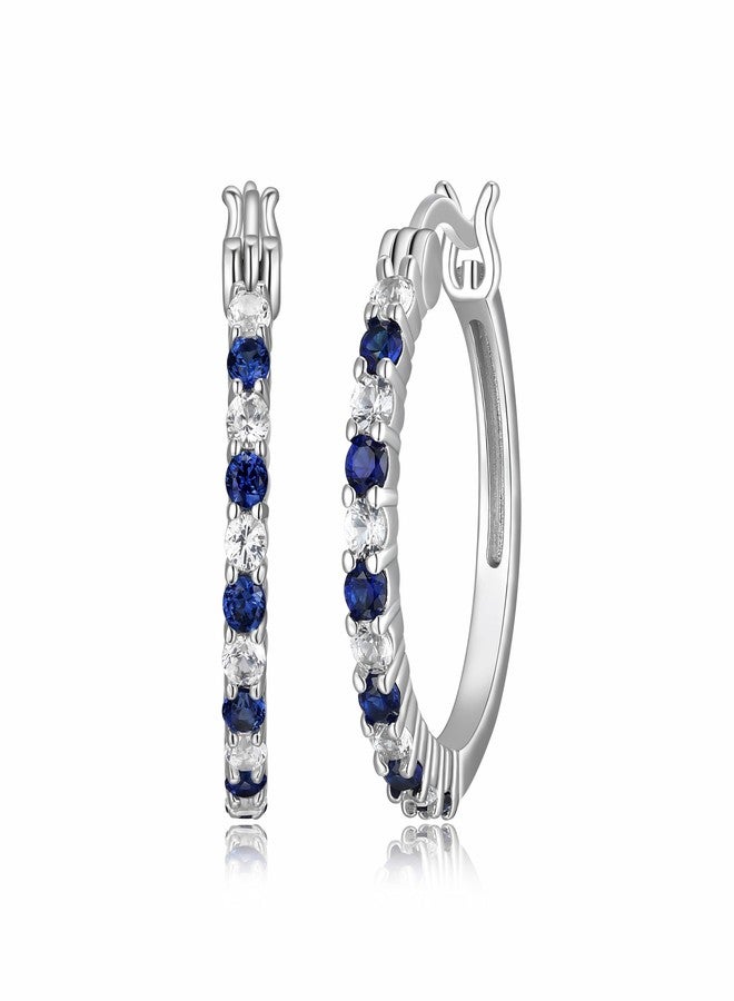 مورجان آند بايدج أقراط حلقية من الفضة الإسترليني عيار 925 مطلية بالروديوم من مورغان آند بيج، مرصعة بأحجار ياقوت أزرق وأبيض متناوبة مصنعة مخبرياً - أقراط من الفضة الإسترليني خفيفة الوزن ومضادة للحساسية - Image 1