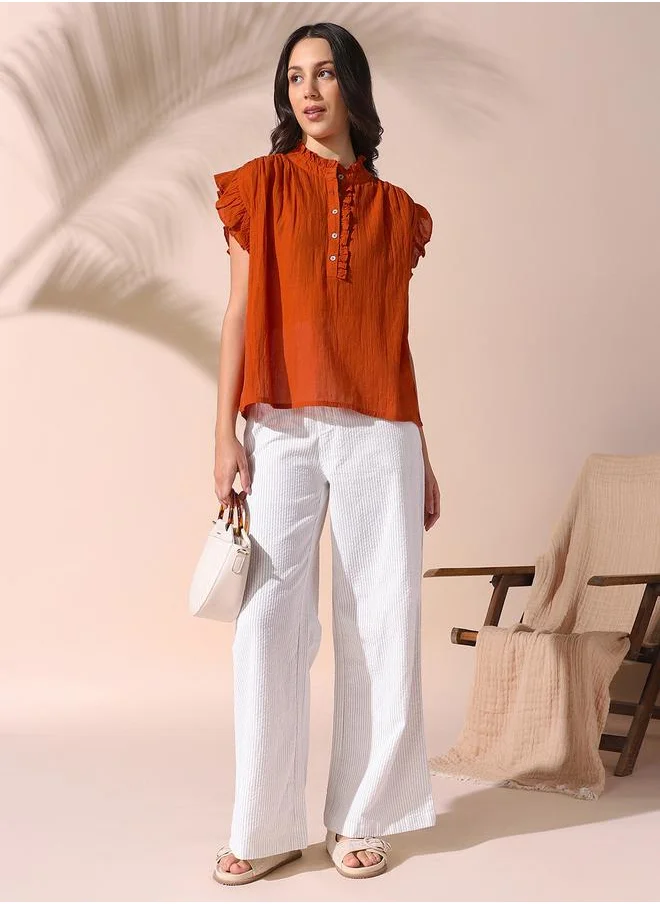 دينيس لينغو Women rust regular fit solid sleeveless t-shirt 100% cotton top with button closure- where comfort meets classic charm.