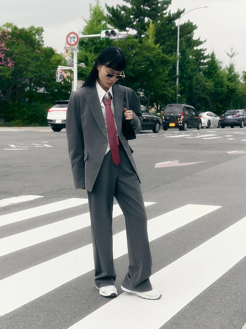 Lichi Straight suiting trousers with stitched creases and a belt