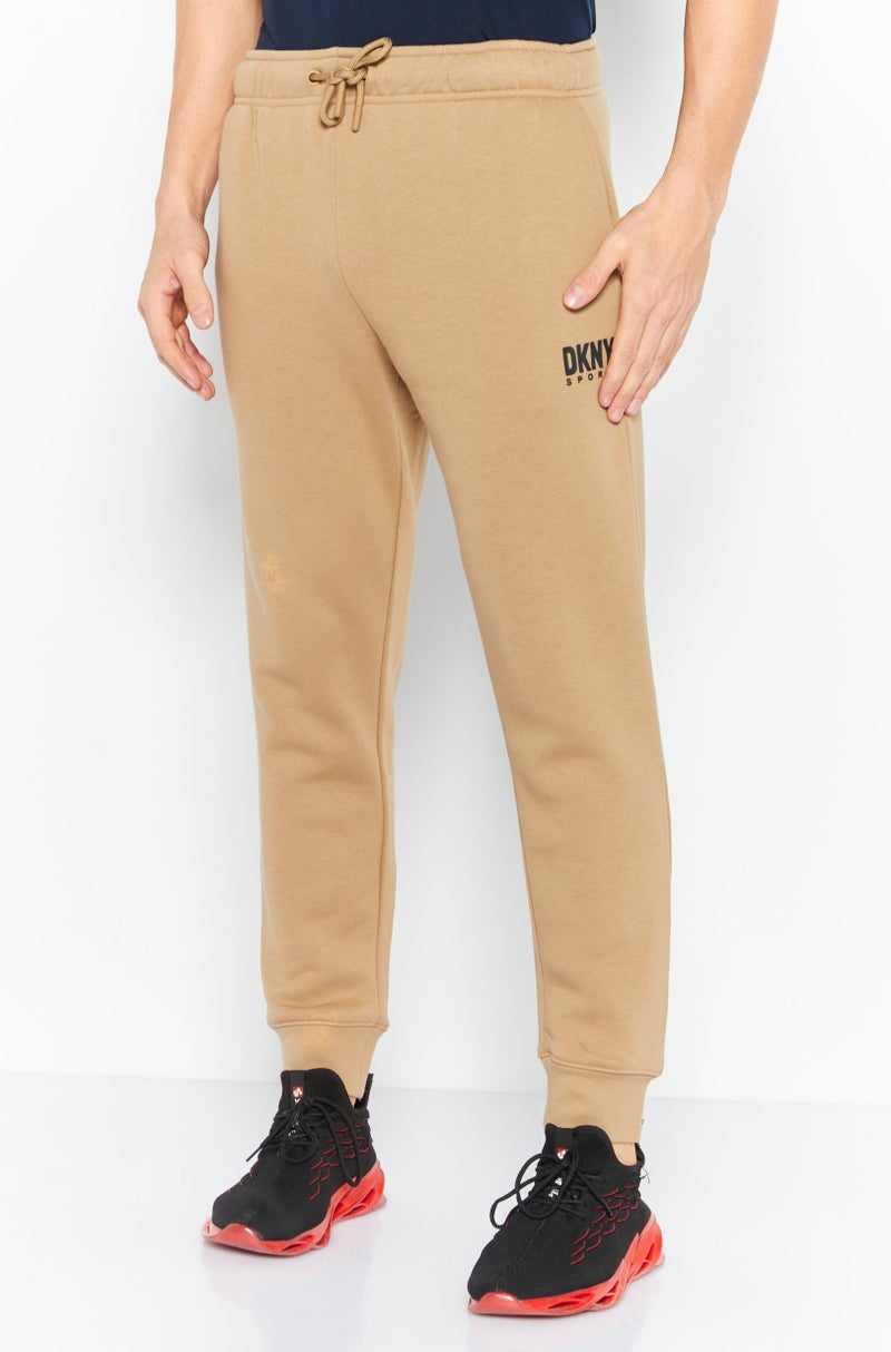 DKNY Sport Men Sportswear Fit Brand Logo Outdoor Sweatpants, Tan  - Image 1