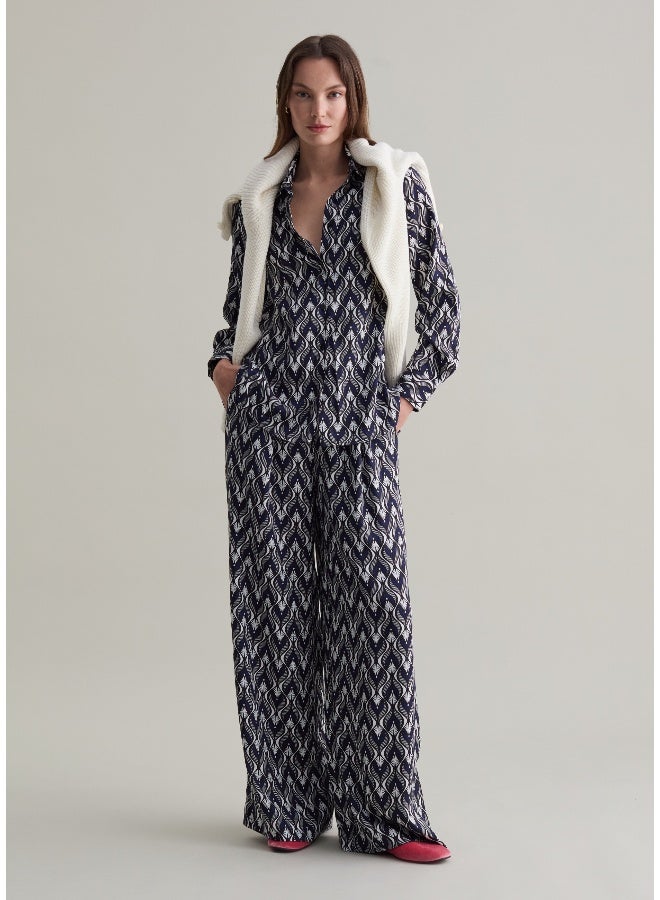 او في اس بنطلون بقصة مريحة وطبعة بنقوش - Image 1