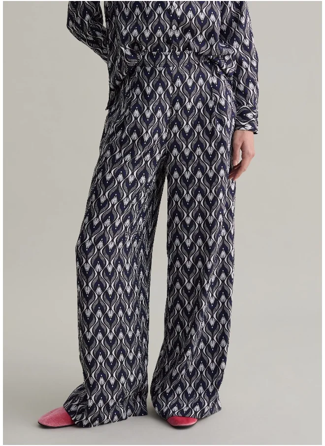 او في اس Relaxed-fit trousers with pattern print