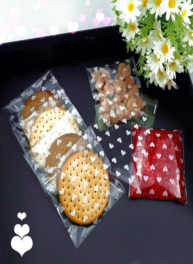SaktopDeco ساكتوب ديكو - 100 كيس حلوى صغير أبيض على شكل قلب من السيلوفان - أكياس حلوى عيد الحب - أكياس سيلوفان ذاتية الإغلاق - أكياس بسكويت - أكياس هدايا - Image 5