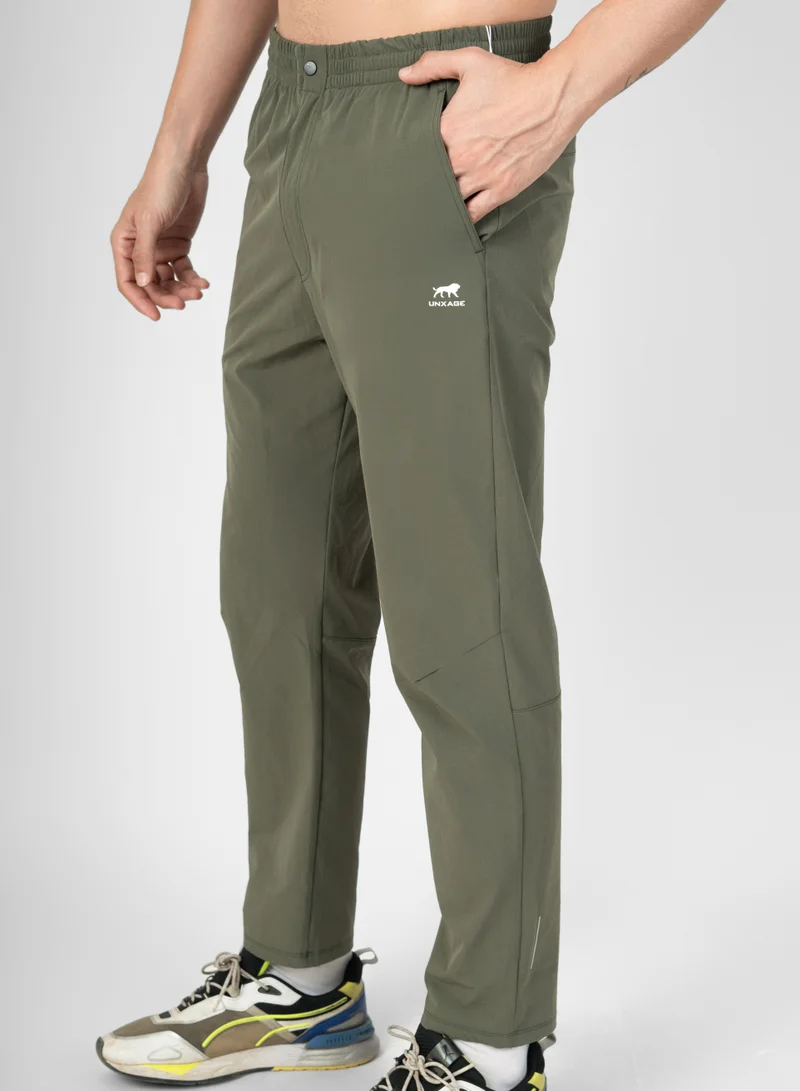 انكسيخ UNXAGE Tactical Training Trousers for Men - Quick Dry Lightweight Joggers | Nylon Tapered Track Pants with Pockets | Reflective Gym Trousers | Military Olive