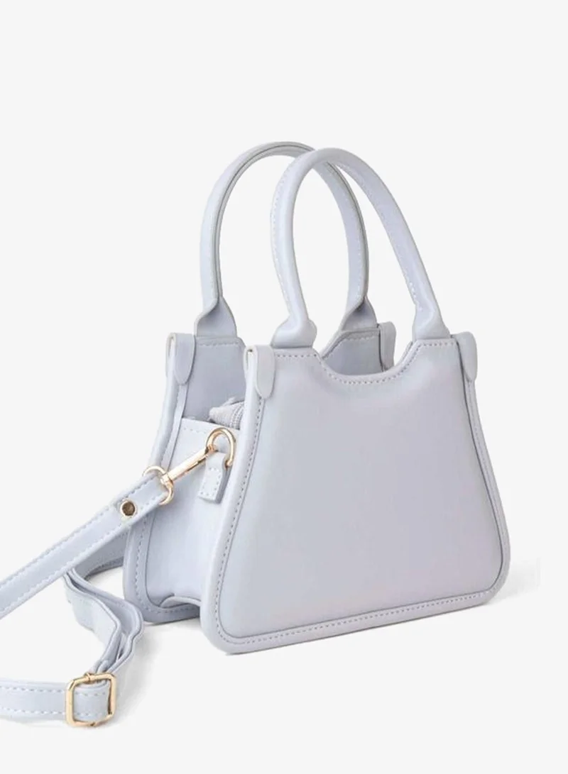 Women's Sakura Gray Small-sized Adjustable Strap Hand and Shoulder Bag with Zipper Closure.