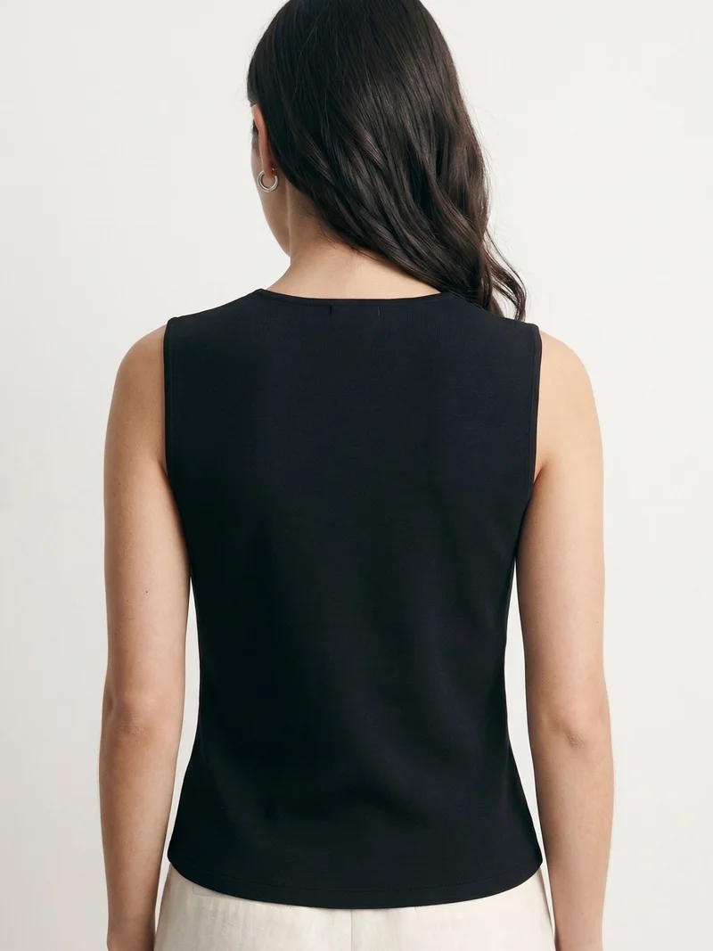 Outzidr  Black Sleeveless Vest With Star-Shaped Buttons for Women | Best Price UAE