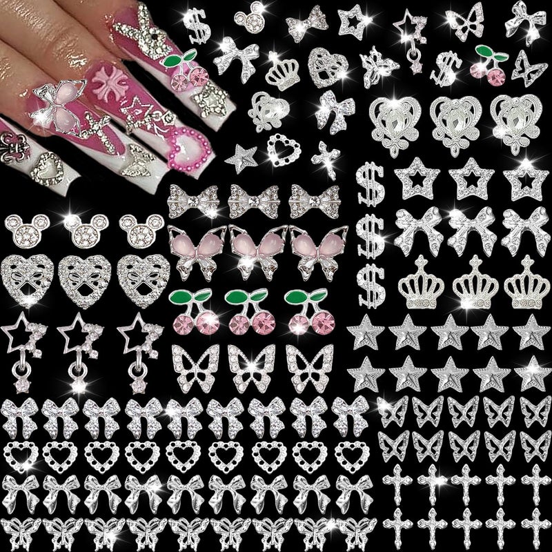 KACHIMOO 106 Pcs Nail Charms and Gems Silver Nail Charms Nail Rhinestones for Nails Design 3D Butterfly, Bow, Star,Cherry,Cross,Dollar,Heart Shapes for Acrylic Nails (19 Styles) - Image 1