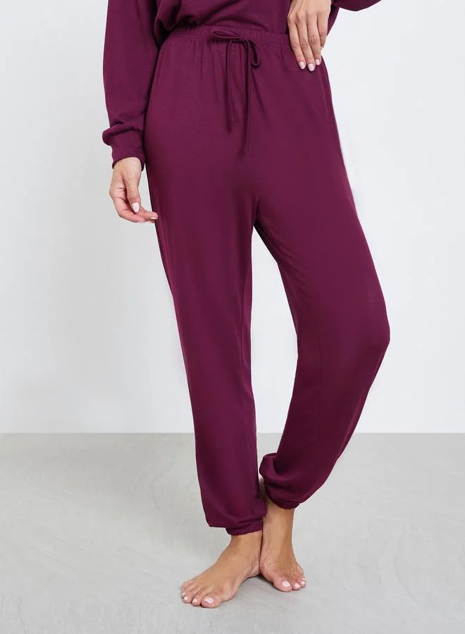 Styli Burgundy Solid Drop Shoulder Long Sleeve Top and Cuffed Pyjama Set for Women | Best Price UAE