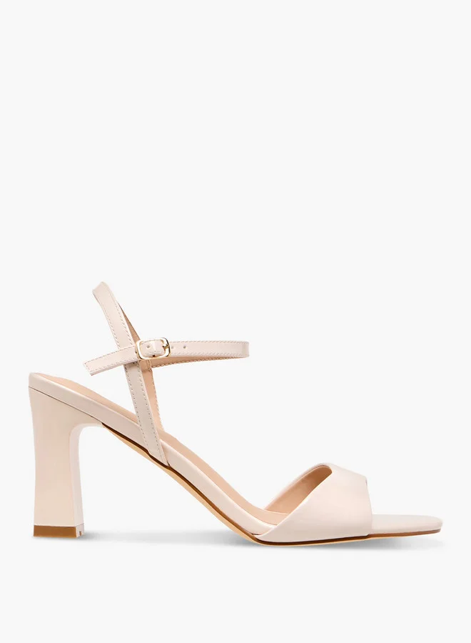 فلورا بيلا من شو إكسبرس Solid Block Heel Sandals with Buckle Closure