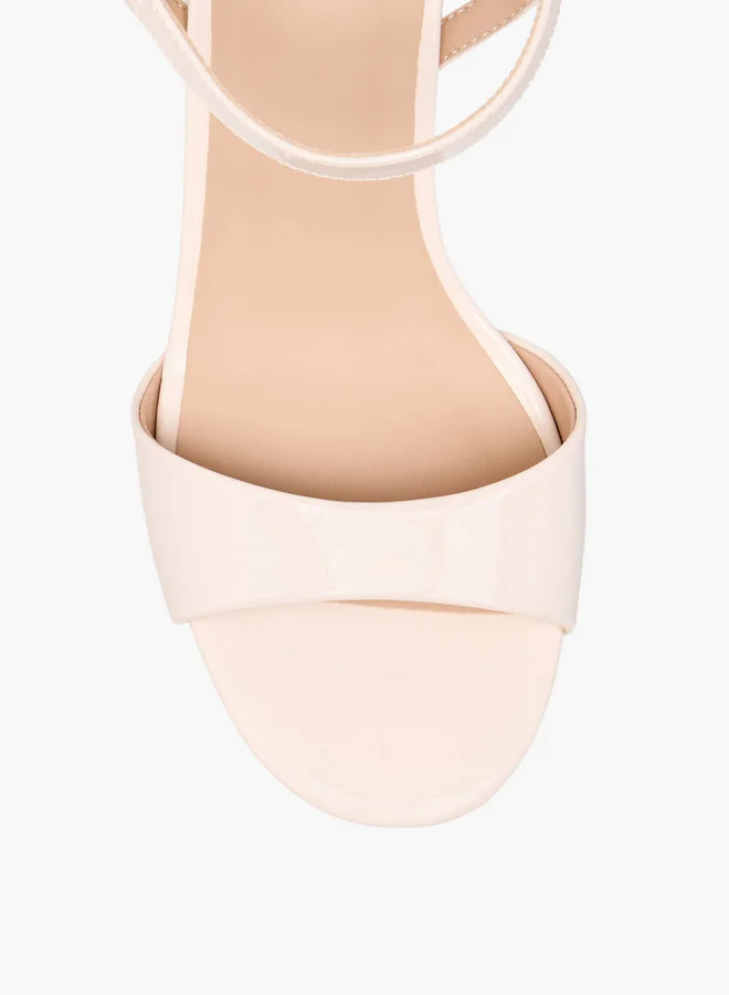 فلورا بيلا من شو إكسبرس Solid Block Heel Sandals with Buckle Closure