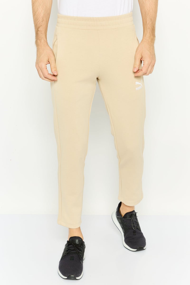 PUMA Men Sportswear Fit Embroidered Logo Outdoor Sweatpants, Beige  - Image 1