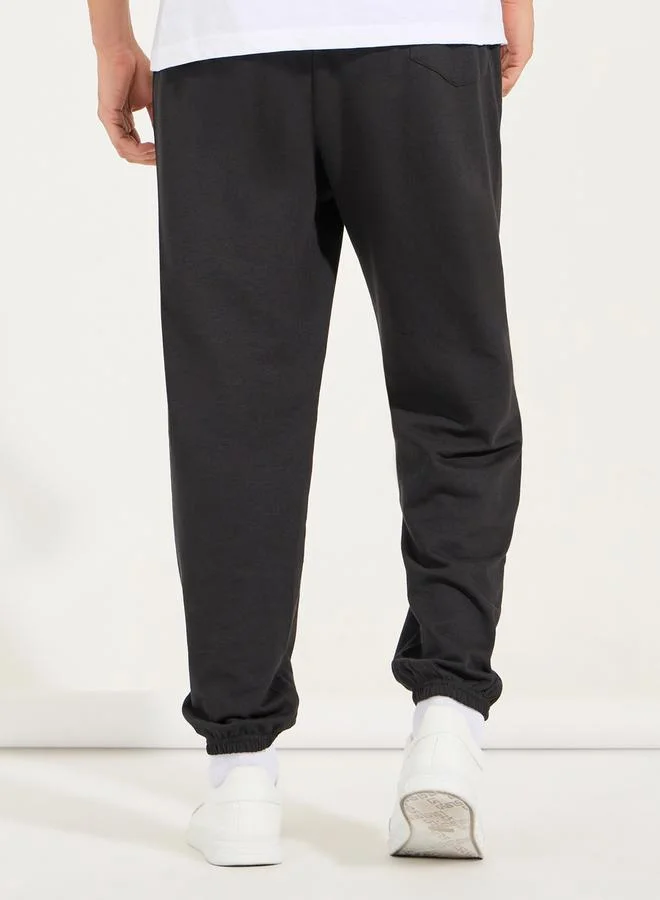 Styli Oversized Text Print Joggers