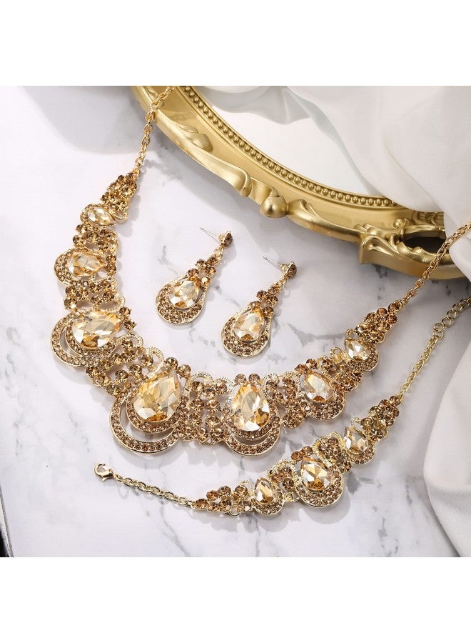 بريلوف طقم مجوهرات نسائي مكون من عقد على شكل دمعة من الكريستال وأقراط متدلية مجوفة وسلسلة وسوار على شكل صدرية لحفلات الزفاف والعروس ووصيفات العروس باللون الذهبي الفاتح - Image 3