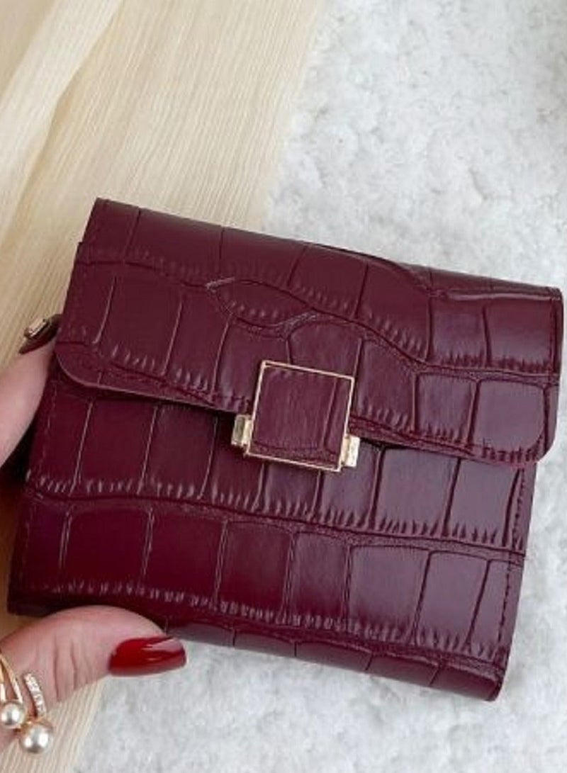 Small women's leather wallet with crocodile pattern and metal clasp - burgundy color - Image 1