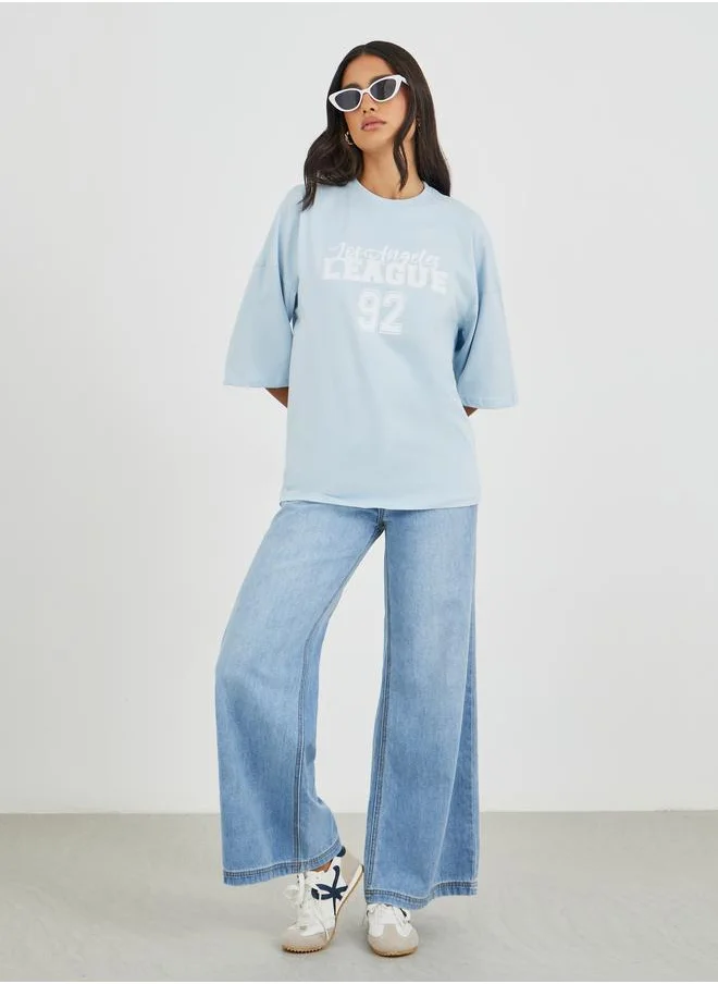 ستايلي Styli Slogan Print Exaggerated Shoulder Oversized T-Shirt
