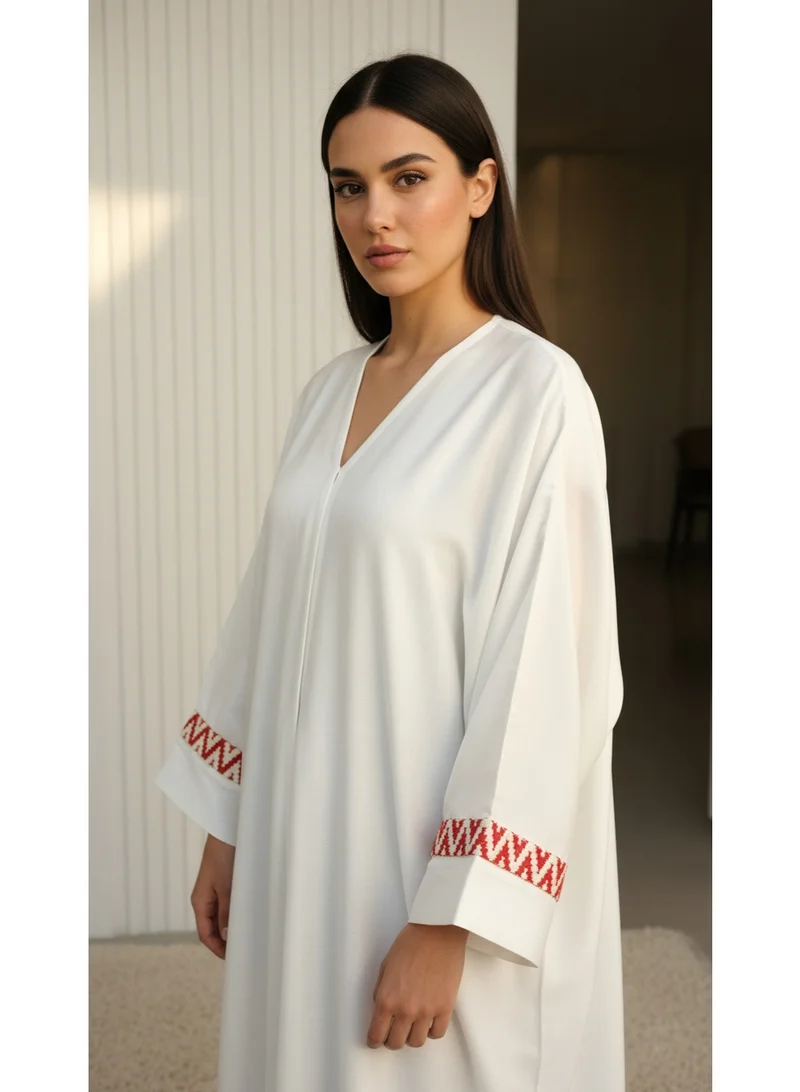 Moistreet  Sophisticated Off-White Abaya Set Featuring Orange Patterned Lace Cuffs for Women | Best Price UAE