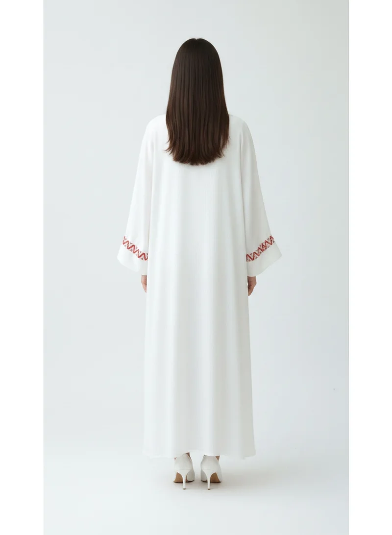 Moistreet  Sophisticated Off-White Abaya Set Featuring Orange Patterned Lace Cuffs for Women | Best Price UAE