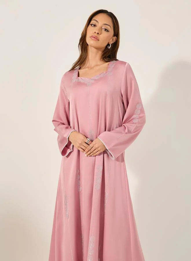 ستايلي matte satin jalabiya with rhinestone pattern embellishment