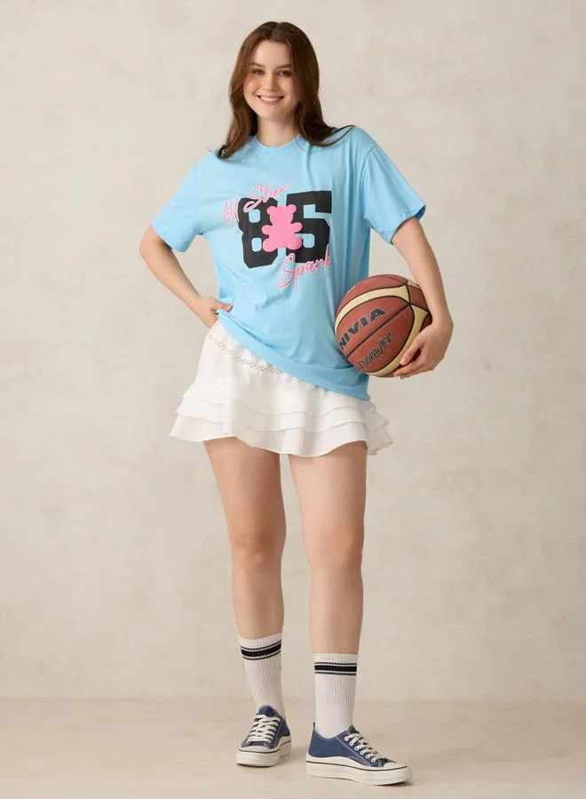 أوجيدر تيشيرت أزرق واسع بطبعة جرافيك