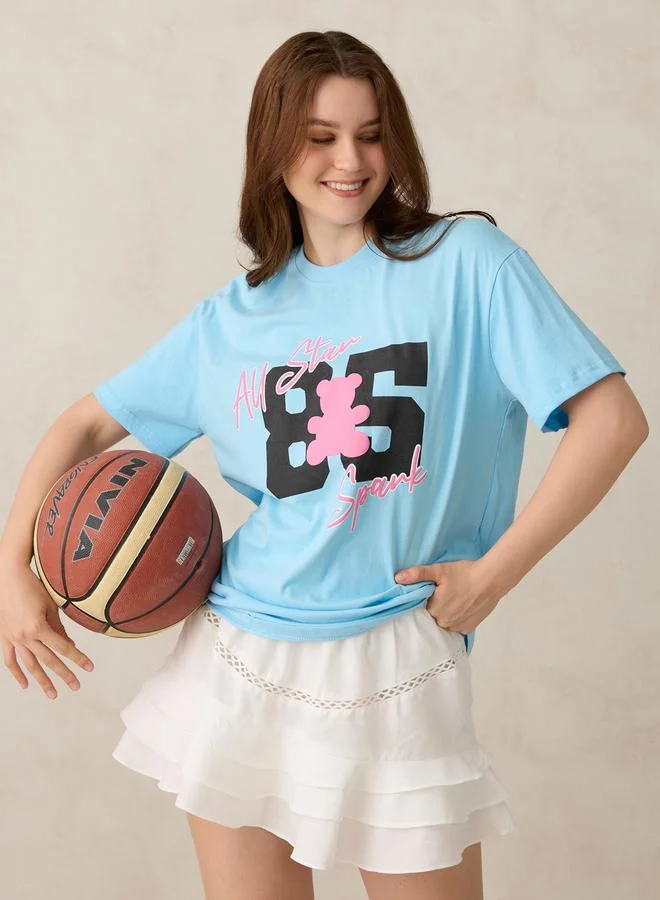 أوجيدر تيشيرت أزرق واسع بطبعة جرافيك