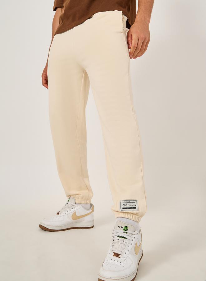 Styli Mid Rise Relaxed Fit Joggers with Badge Detail  - Image 1