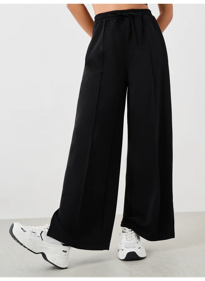 Styli Styli Pin Tuck Wide Leg Joggers with Side Seam Slit