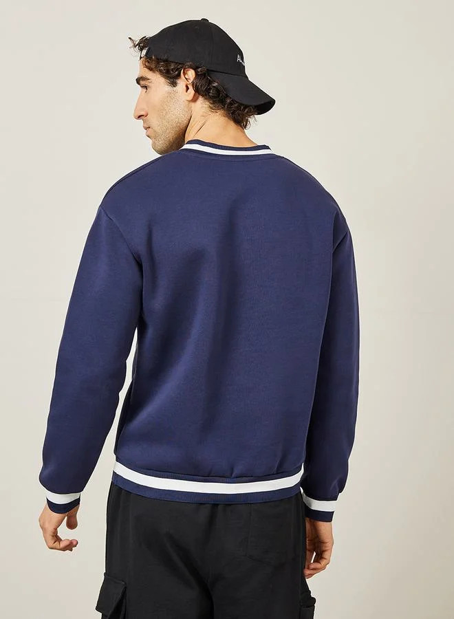 Styli Graphic Print V Neck Ribbed Varsity Sweatshirt