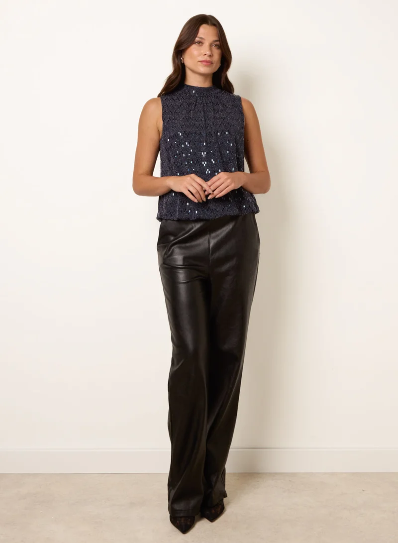 بلو فانيلا High Neck Metallic Puff Ball Blouse