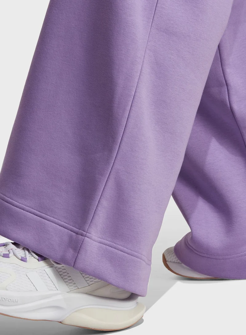 adidas بنطال لوغومانيا بأرجل واسعة