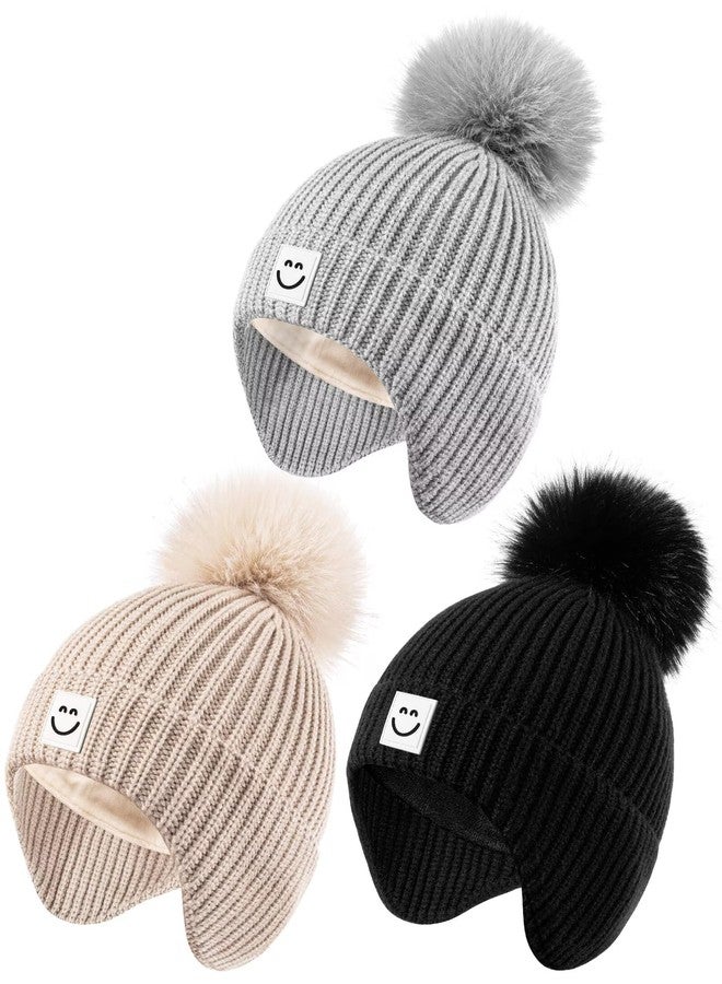 Alepo 3 Pack Baby Winter Hats with Earflaps, 2 Size Kids Pom Pom Beanie with Warm Fleece Lined for Infant Toddler Children, Cute Smiley Face Knit Beanie Hats for Girls Boys-01 - Image 1