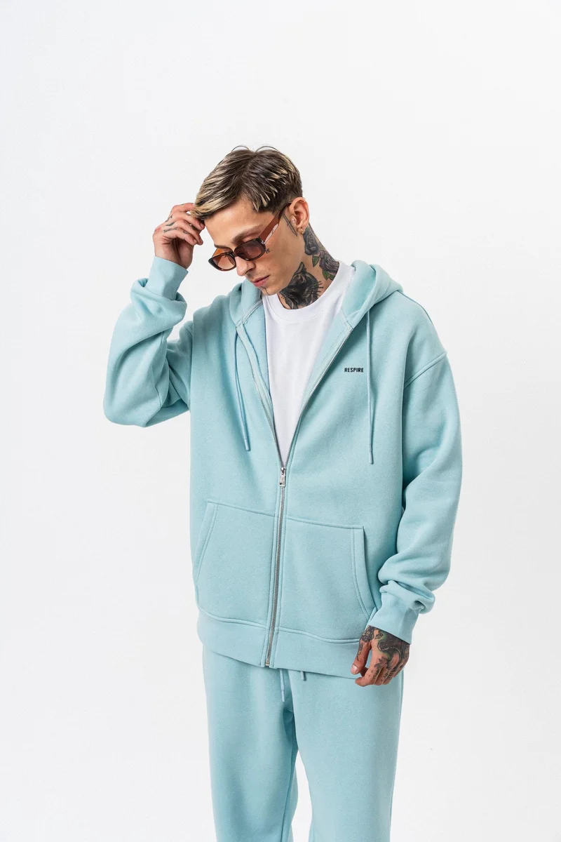 ريسباير هودي رجالي أساسي واسع (Oversize) بسحاب (Zip) بغطاء رأس بتفاصيل نص "Respire" لون أزرق فاتح