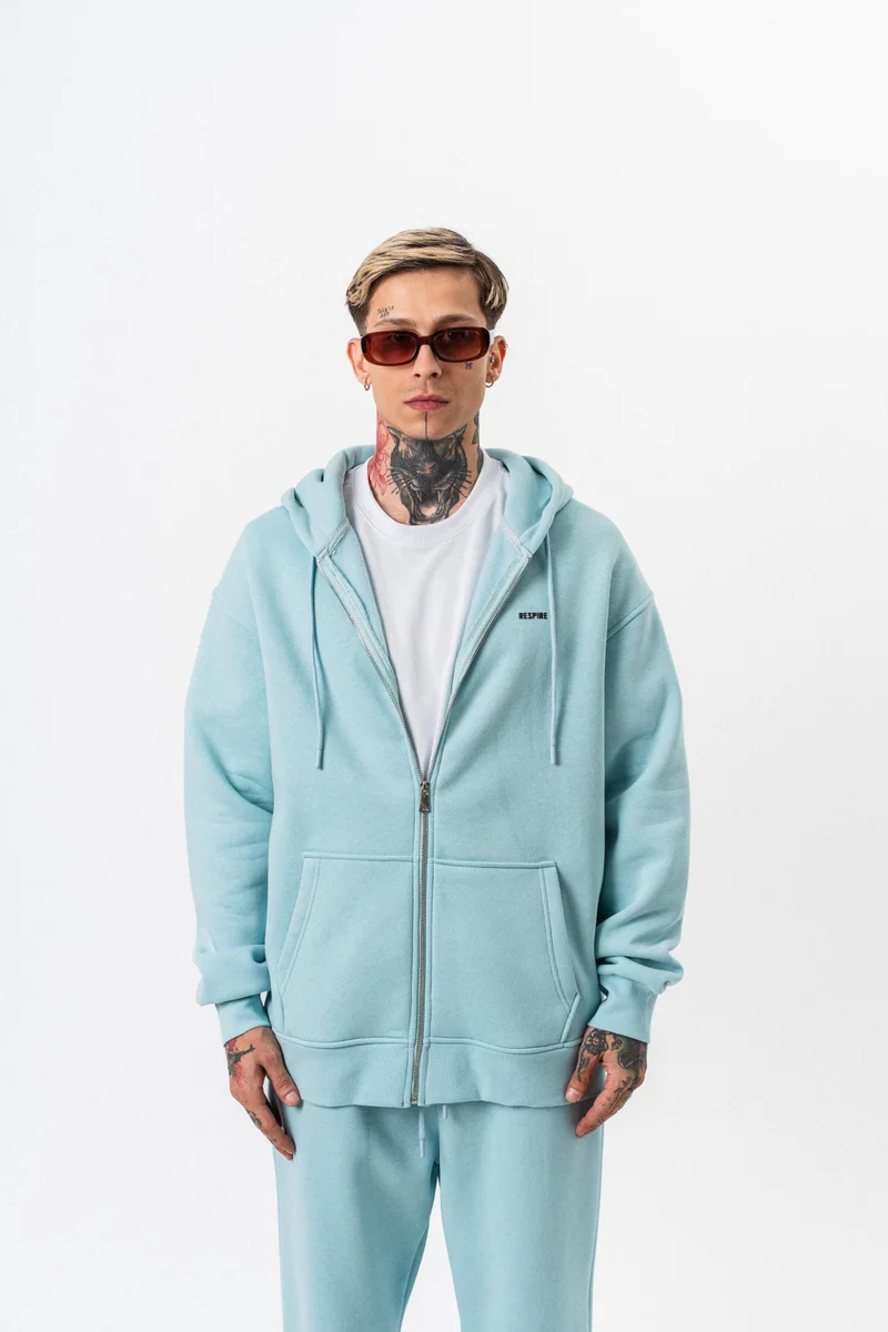 ريسباير هودي رجالي أساسي واسع (Oversize) بسحاب (Zip) بغطاء رأس بتفاصيل نص "Respire" لون أزرق فاتح