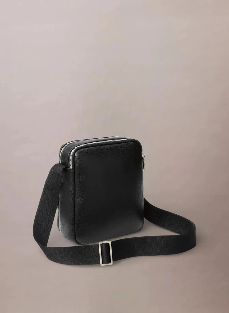 Calvin Klein Black Textured Logo Crossbody Reporter Bag for Men | Best Price UAE