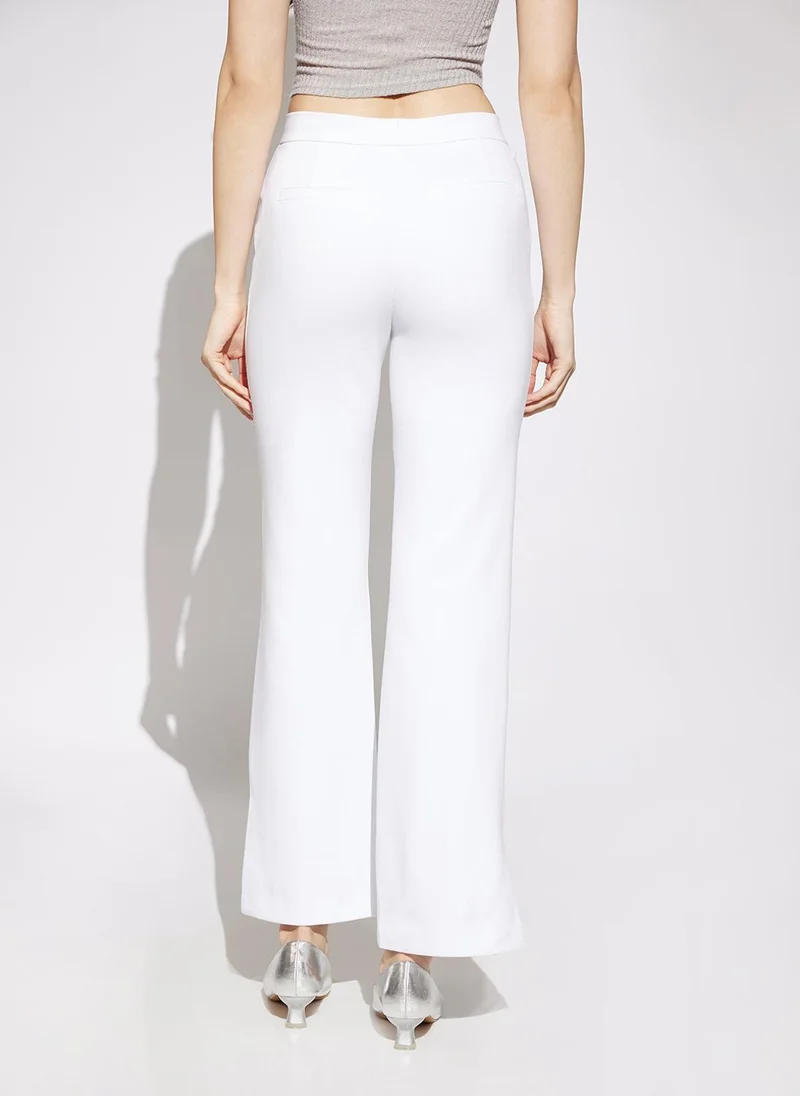 globus Globus Women White Solid Mid Rise Straight Fit Stretchable Trousers